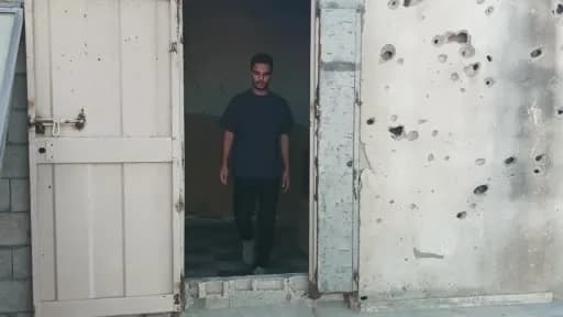 Gazze’de hasar gören binanın duvarına ABD’li rapçi Macklemore’un resmini yapan Filistinli sanatçı Aby Qershala