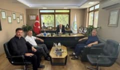 Mehmet Ertaş Edremit Ticaret Odası yöneticileriyle toplantı yaparken