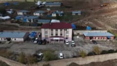 Erzurum Çat Sarıkaşık köyünde açılan Şehit Ramazan Yıldız Kütüphanesi ve öğrencilere kışlık giysi dağıtımı